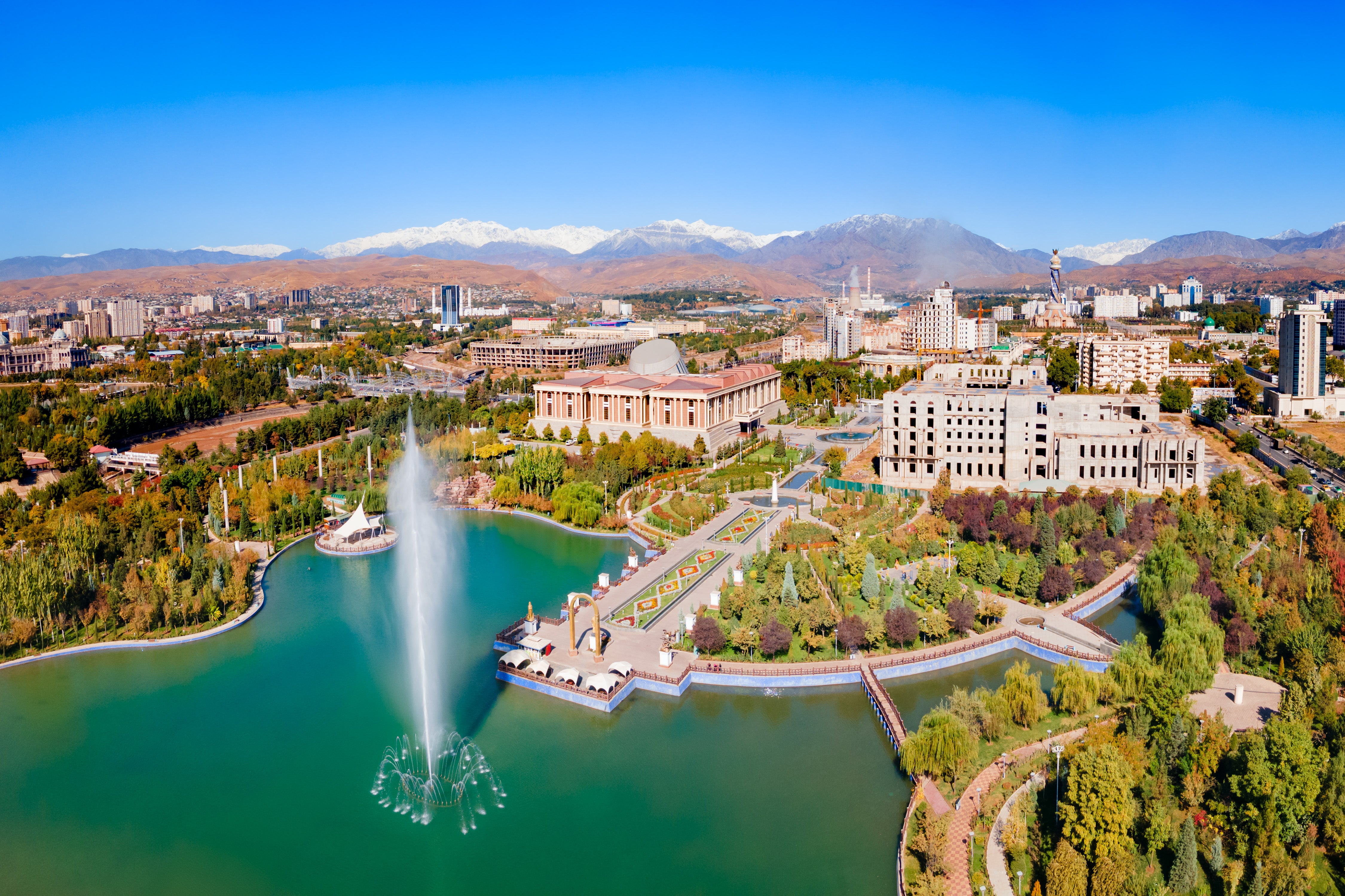 This panoramic view features the National Museum of Tajikistan and the surrounding Rudaki Park in Dushanbe