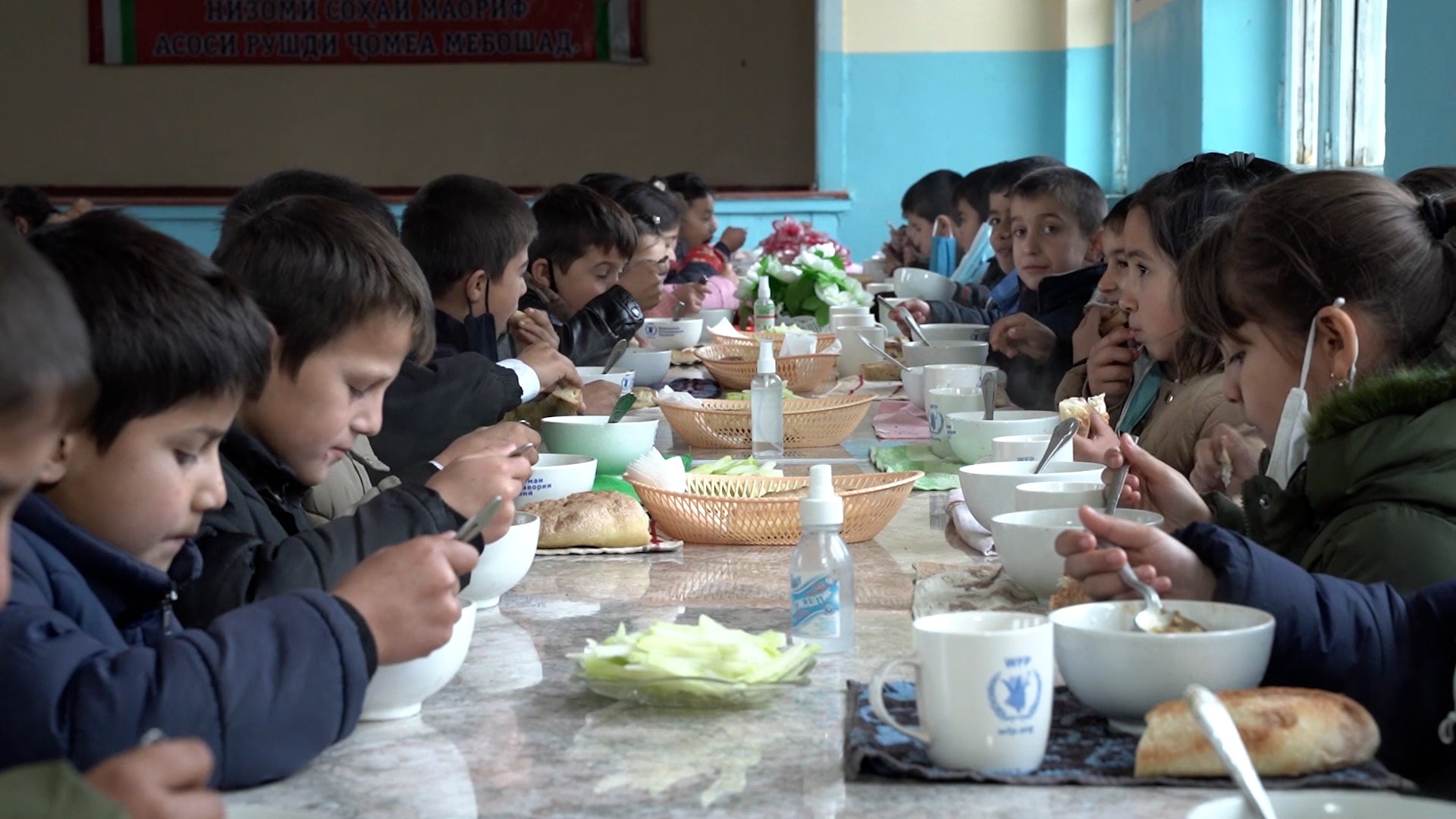 Kids eating in a canteen