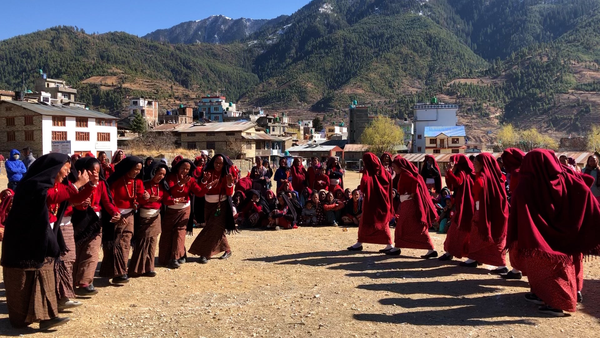 Nepali women in traditional apparel dancing