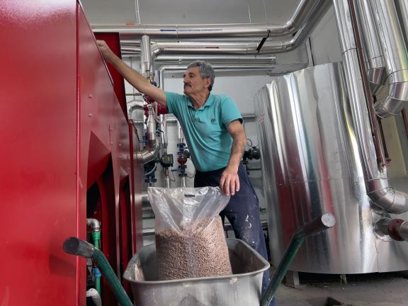No longer burning coal. The school now uses an energy-efficient, low-carbon heating system powered by pellets. Photo/GCF Angeli Mendoza