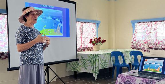 Celine Dyer engaged in community discussions in Manihiki. Photo: Charlene Akaruru