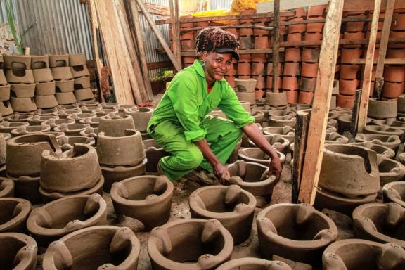 Naomi Ngotho showcasing the freshly made ceramic liners in her ICS workshop in Murang’a County, Kenya.