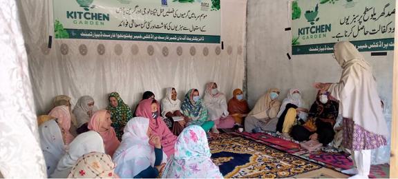 Women learn about food preservation and kitchen gardening in Reshun Valley. The new skills will help secure their livelihoods and financially empower them, especially in the event of glacial lake outburst floods and other climate-induced disasters. Photo: UNDP/Muhammad Hussain